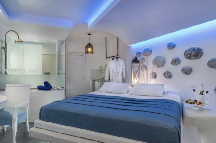 Comfortable bed and plush bathrobes in the Suite with Pool View at Kouros Home and Suites in Faliraki, Rhodes.