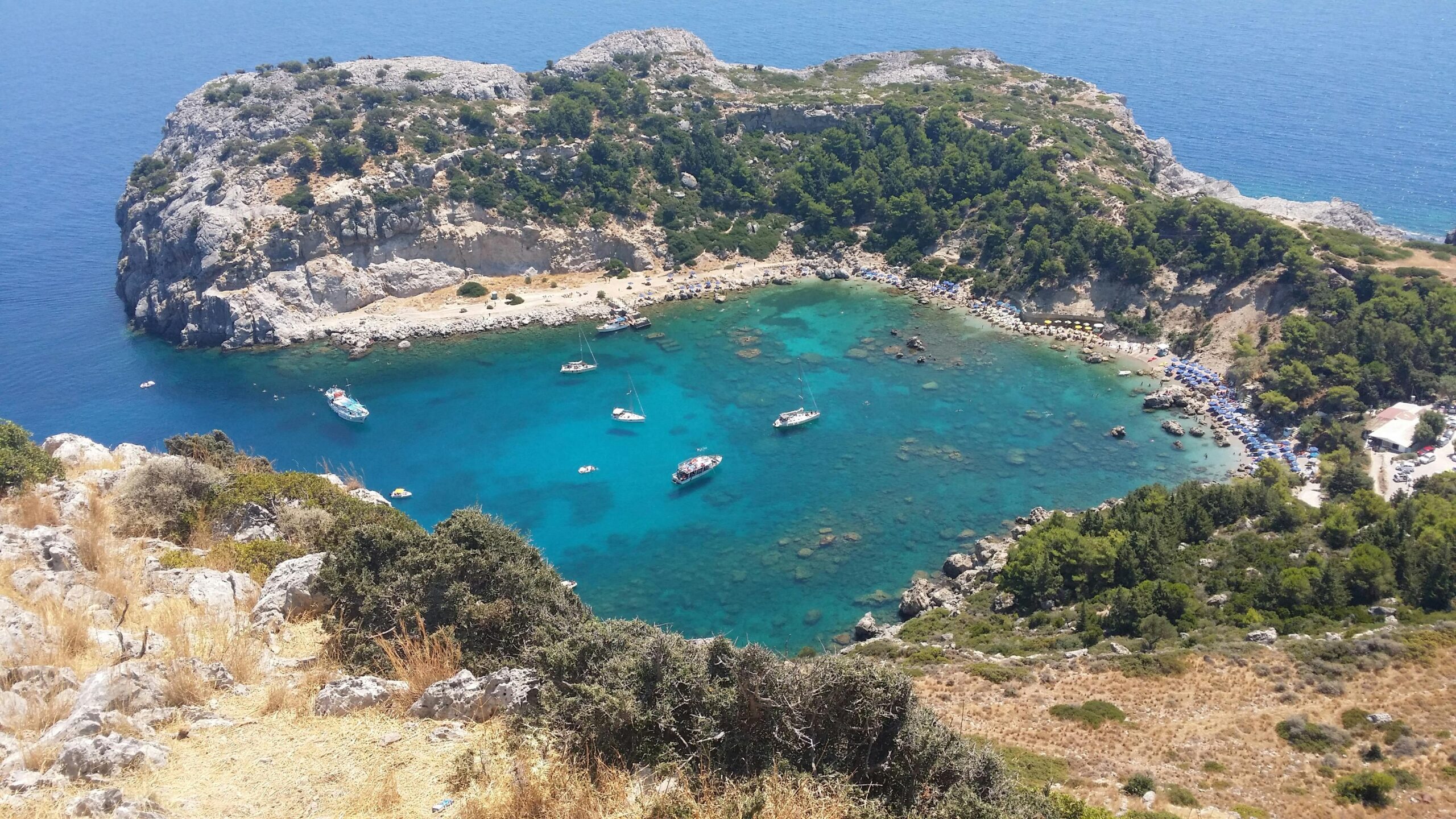 Beautiful emerald waters of the famous Anthony Quinn Bay beach near Kouros Home and Suites in Faliraki Rhodes